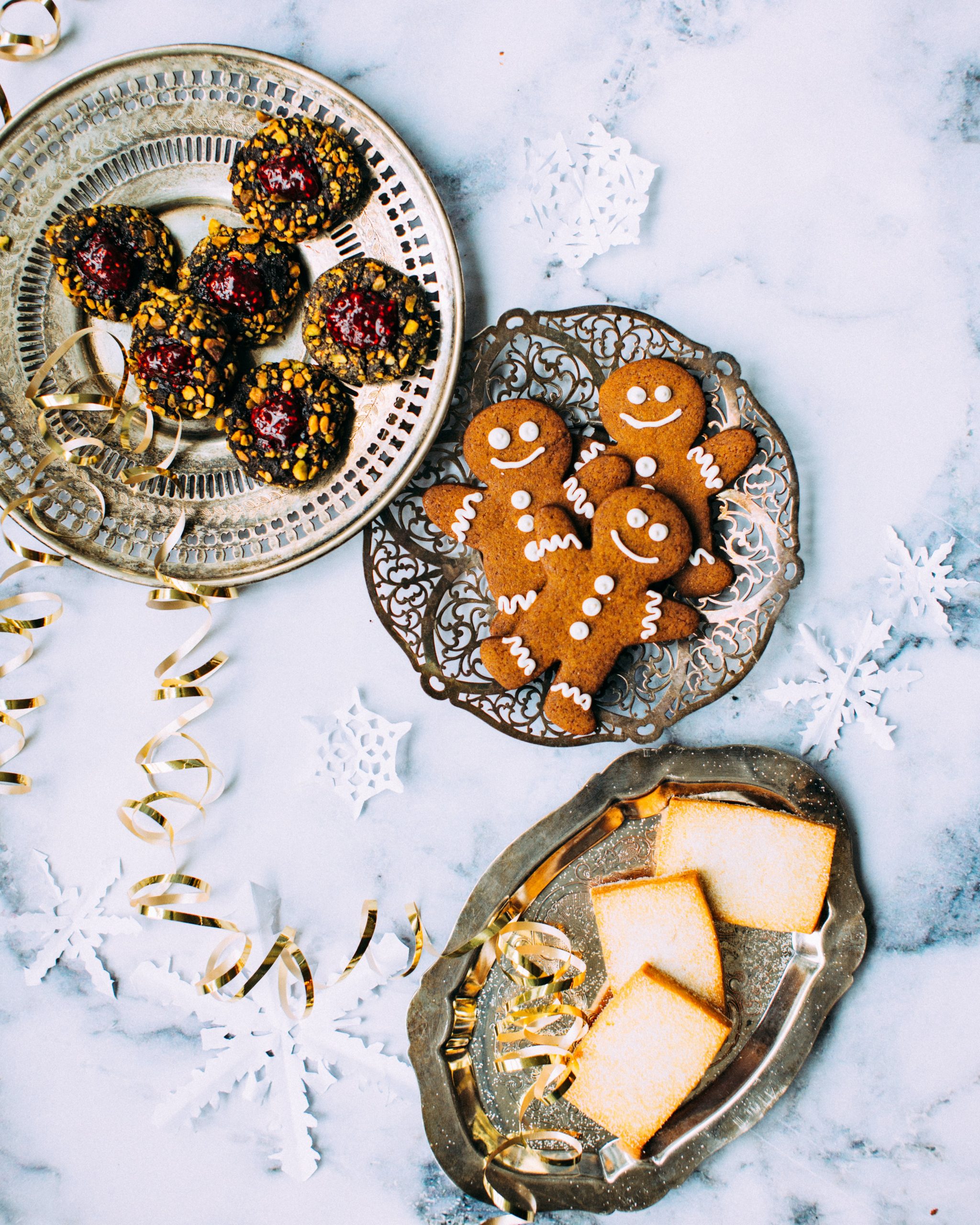 A plate of gingerbread men cookies with icing