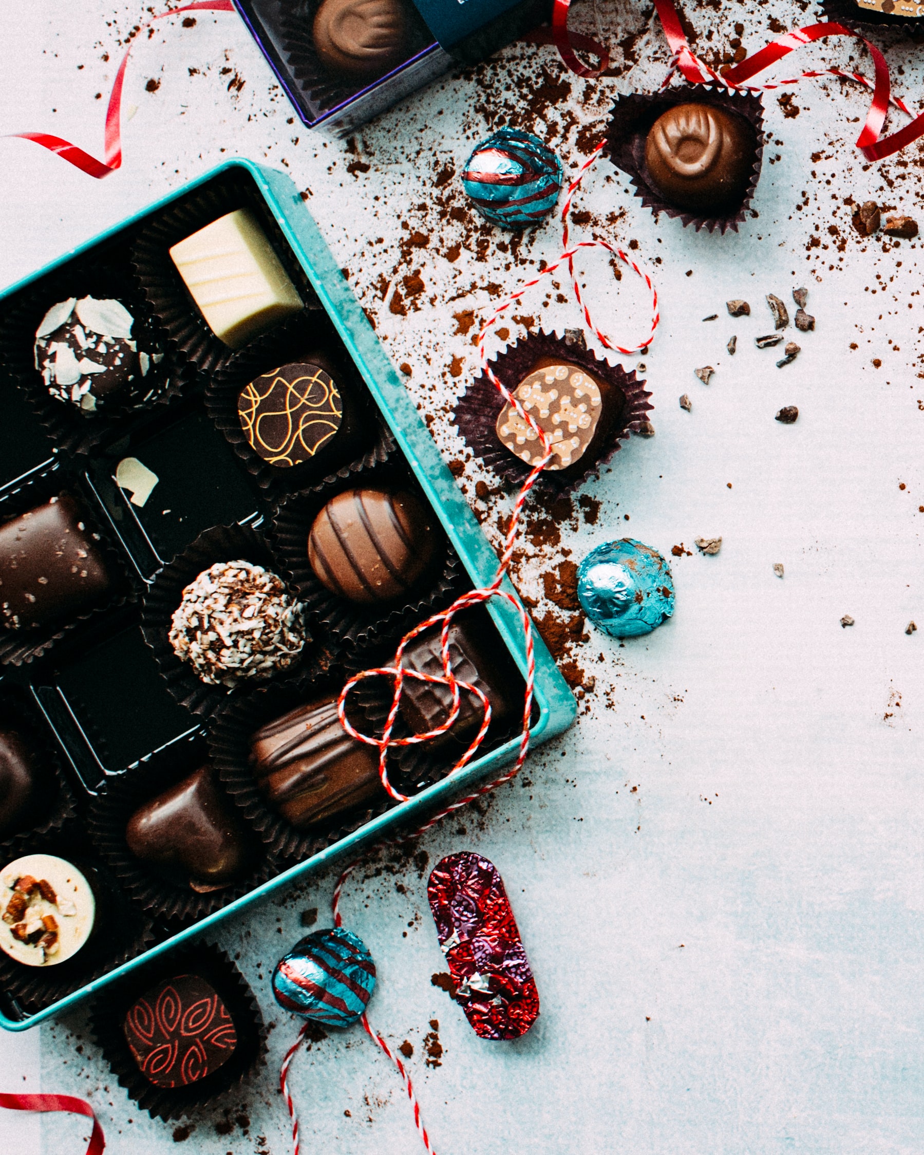 A box of assorted chocolates in different shapes and patterns