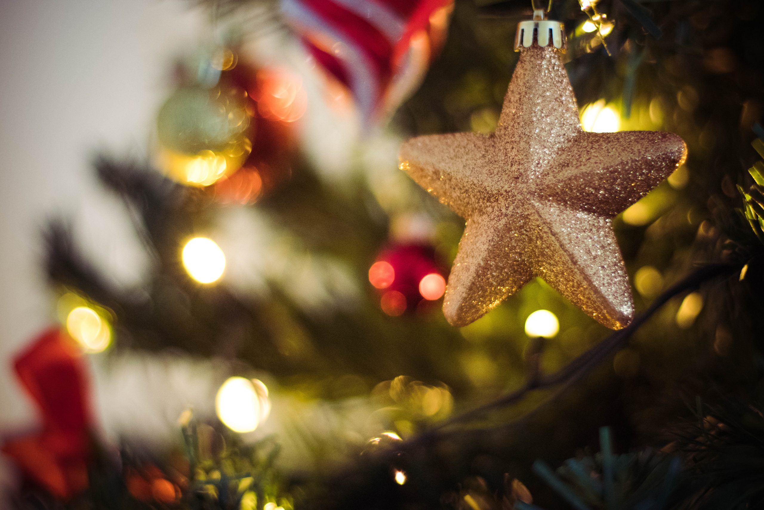 A star hanging from a Christmas tree
