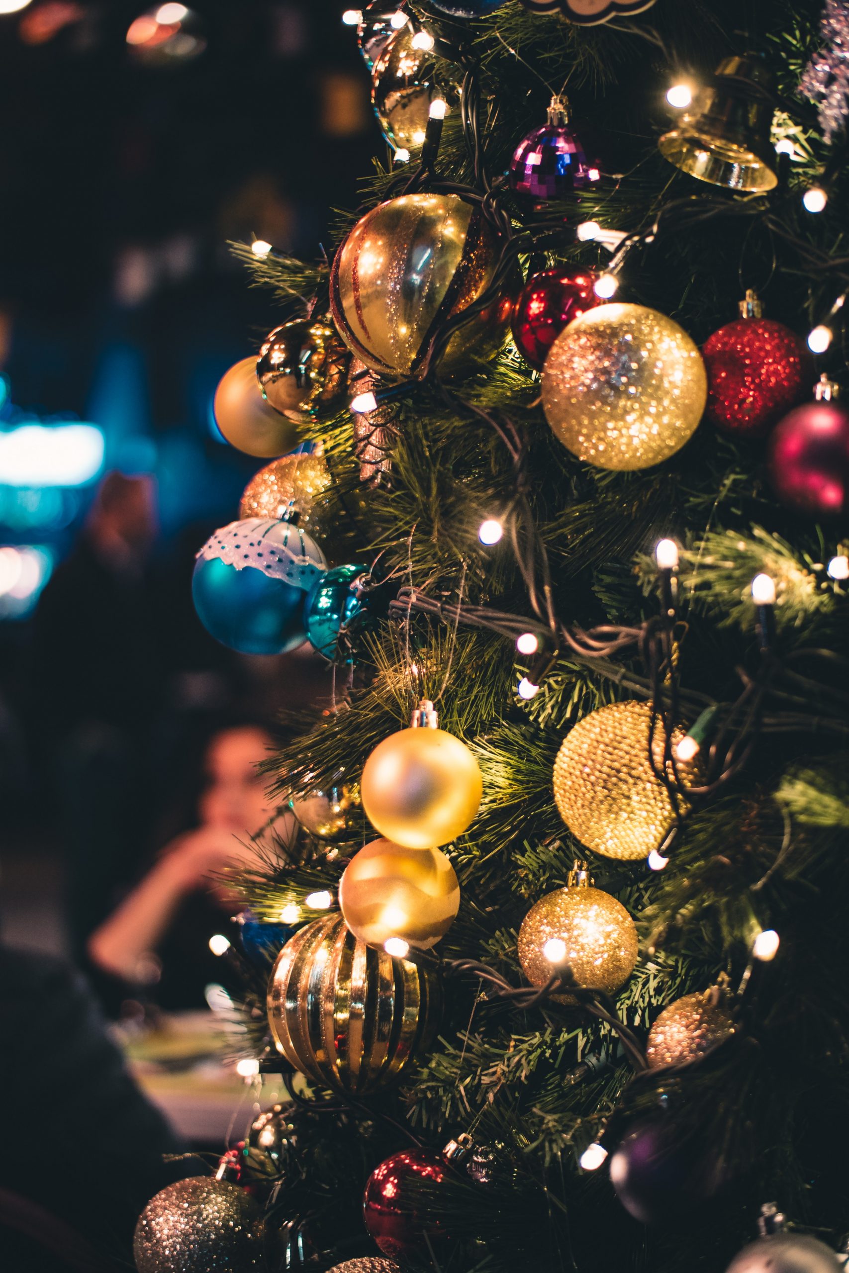 A Christmas tree decorated using a variety of baubles or balls.