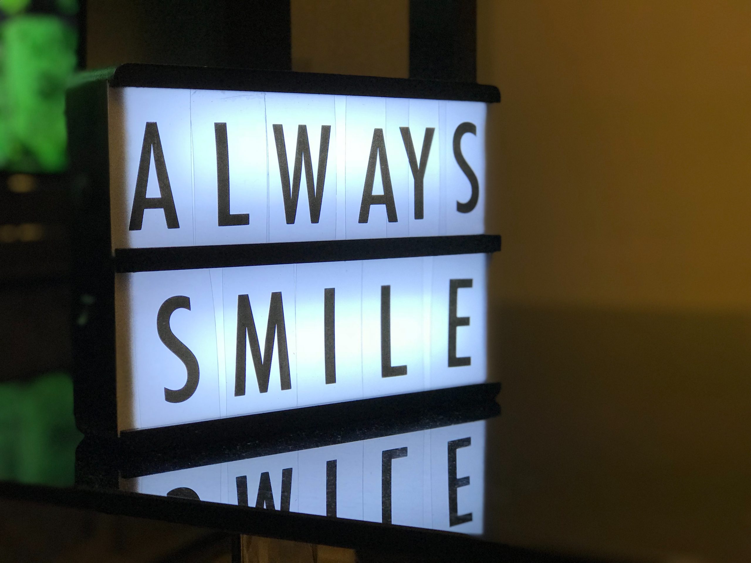 Cinema lightbox displaying always smile A cinema lightbox that says ALWAYS SMILE.