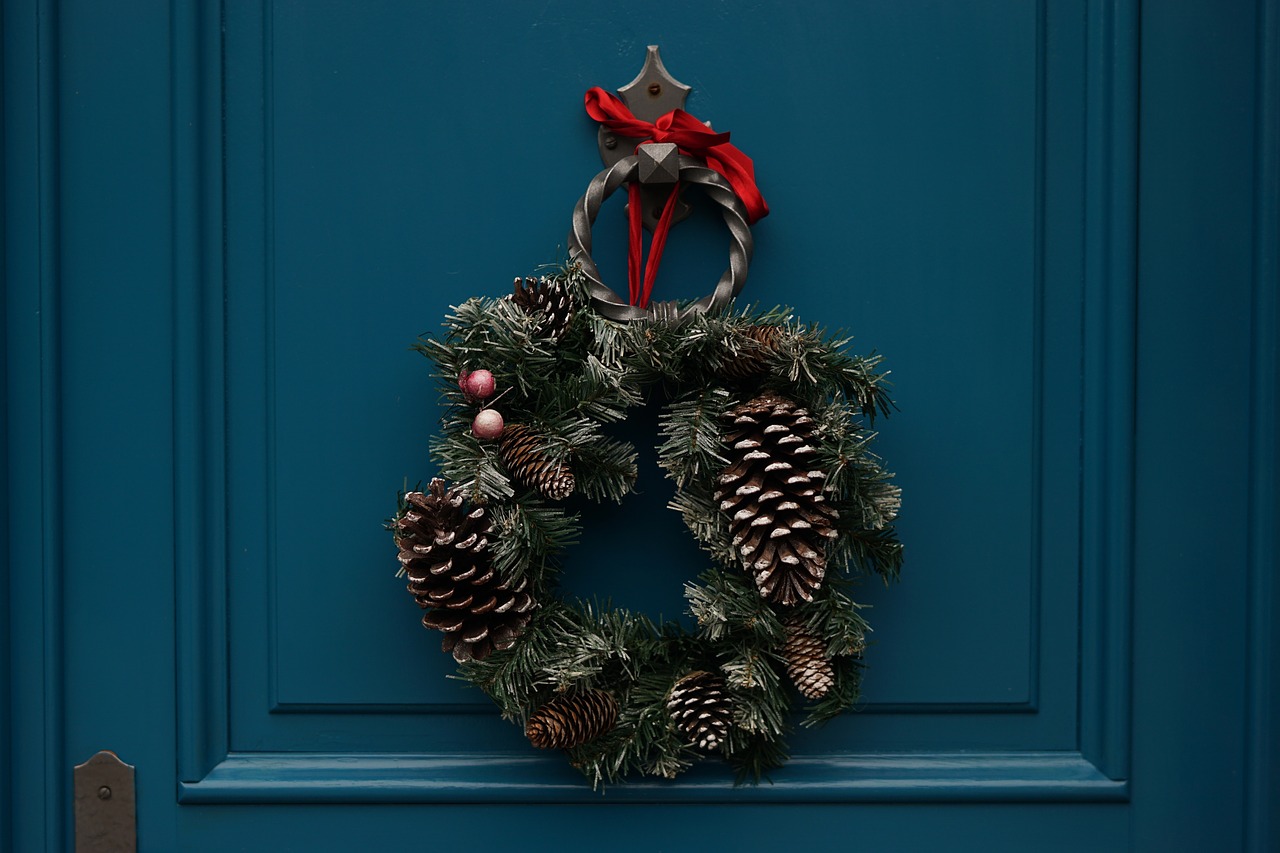 A rustic Christmas wreaths with silver pinecones